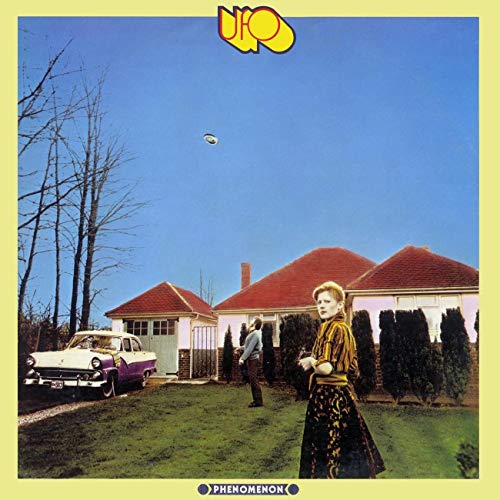 Album cover: UFO's "Phenomenon" with a woman, house, and flying saucer.