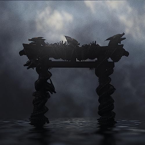 Dark, ornate Torii gate silhouette against a misty, cloudy sky.