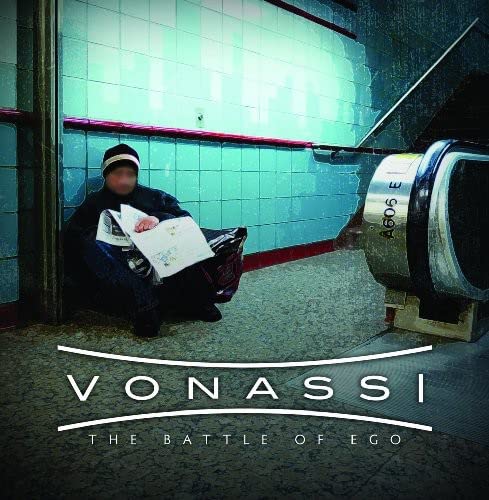 CD cover: hooded figure reading in a tiled subway station.