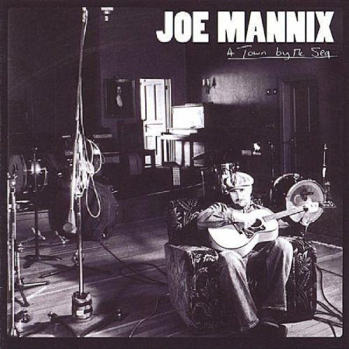 Black and white CD cover featuring a musician with a guitar.