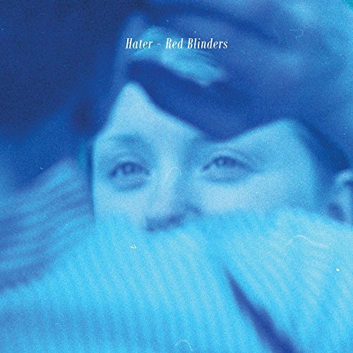 Blue-toned CD cover featuring a blurred portrait of a person.