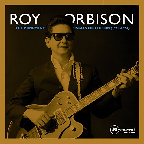 Roy Orbison with guitar on album cover, sepia tone.
