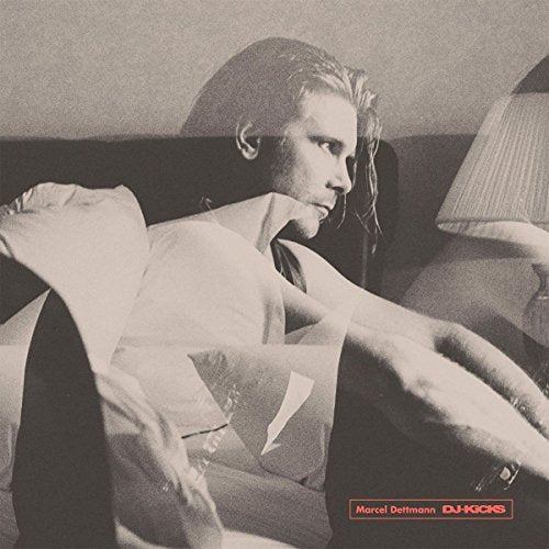 Black and white album cover featuring a man relaxing indoors.
