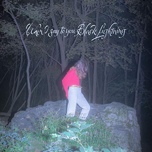 CD cover: person in red facing a dark, wooded landscape.