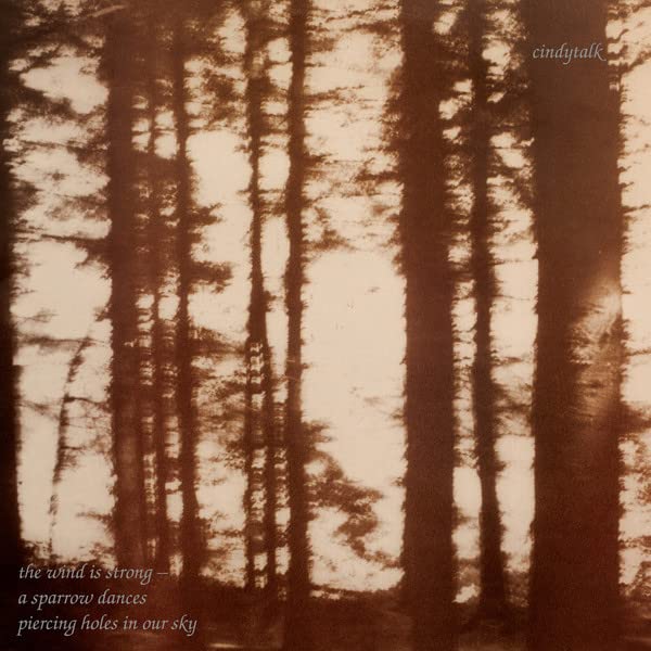 Vinyl record cover with abstract, blurred image of trees in sepia tones.