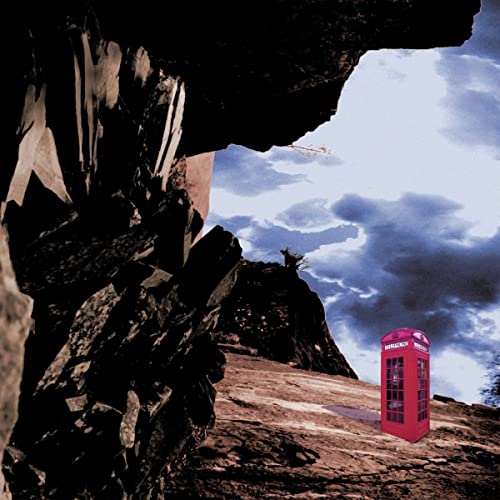 Album cover with rocky landscape, red phone box, and cloudy sky.