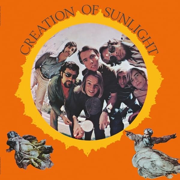 CD cover: group portrait within a sunburst, with sculptures below.