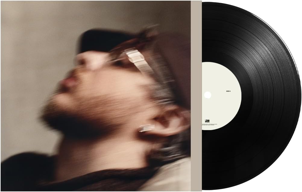 Jack Harlow's "Monica" vinyl record, featuring a blurred portrait.