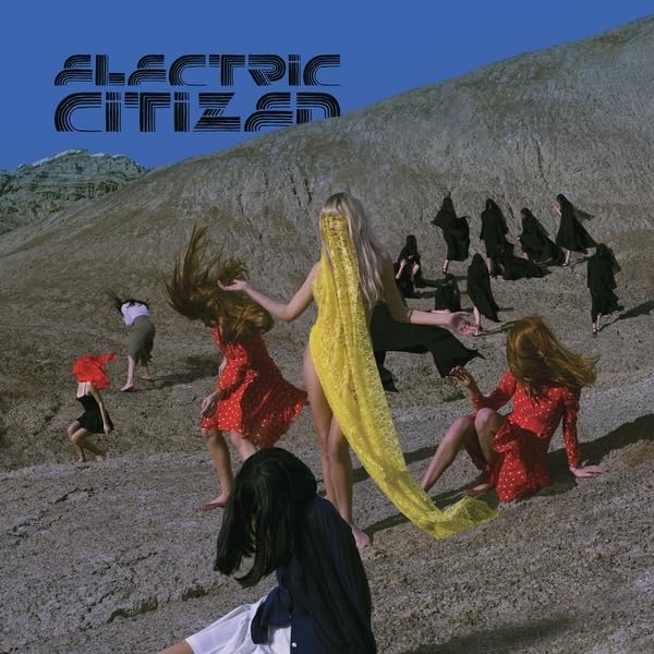 Album cover: people in colorful clothing on a hilly landscape.