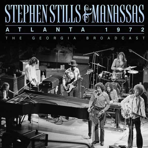 Black and white photo of Stephen Stills & Manassas performing onstage.