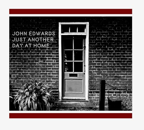 Black and white album cover featuring a brick house door and foliage.