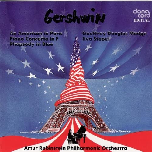 CD cover: Eiffel Tower wrapped in an American flag, pianist below.