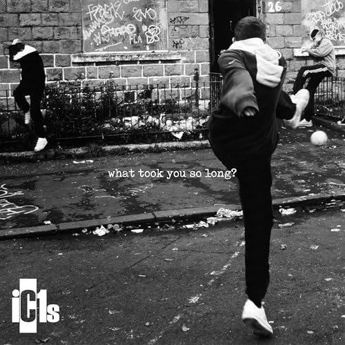 Black and white album cover featuring people playing football in a city.