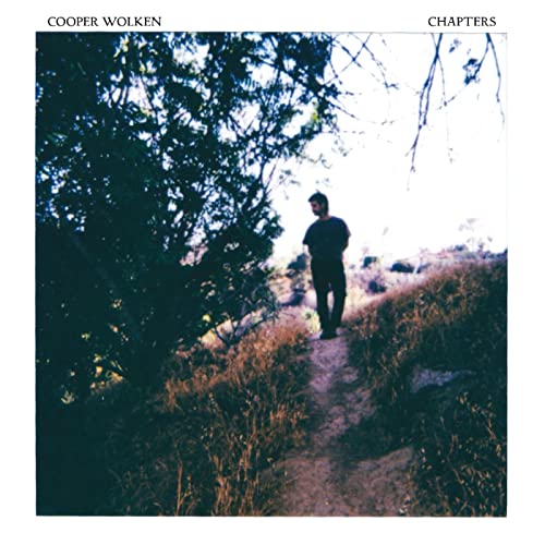 Album cover for Cooper Wolken’s “Chapters” featuring a man walking in nature.