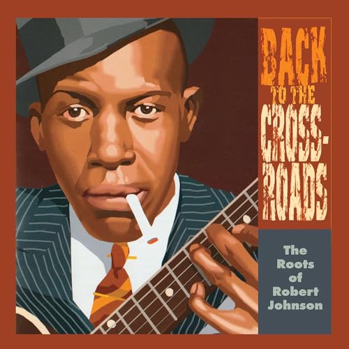 Portrait of a man with a guitar, album cover for “Back To The Crossroads.”
