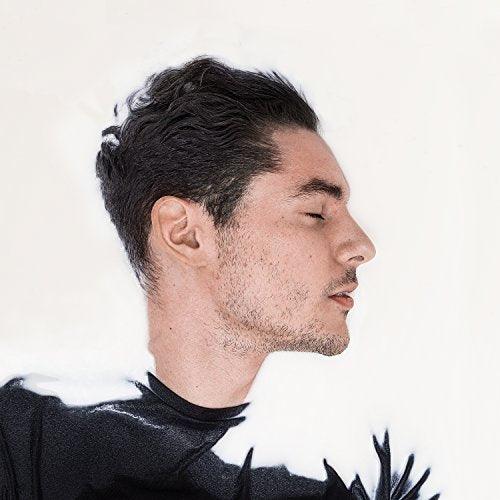 Profile of a man with short dark hair and textured black clothing.
