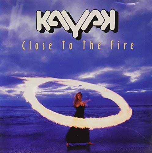 Kayak album cover, “Close To The Fire,” featuring a woman and fire circle.