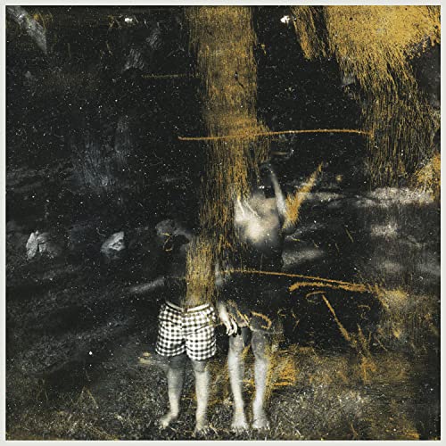 Dark album cover with abstract gold streaks and a figure with obscured face.