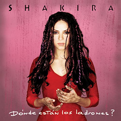 Shakira album cover, “Donde Estan Los Ladrones,” featuring the artist in red.