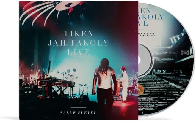 CD cover for Tiken Jah Fakoly’s “Live Salle Pleyel” with musician’s back view.