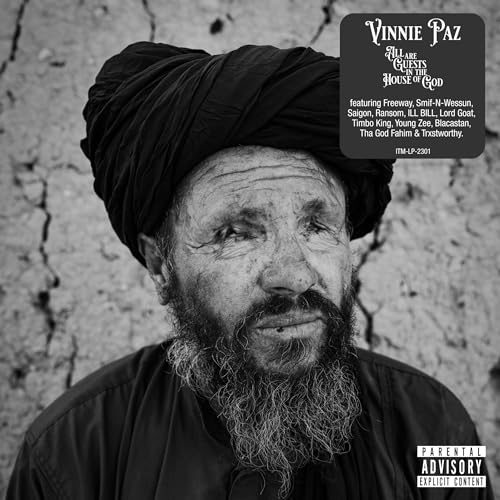 Black and white album cover featuring a portrait of a bearded man in a turban.