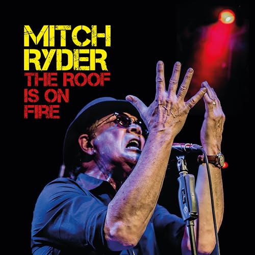 Mitch Ryder singing into a microphone, album cover for "The Roof Is On Fire".