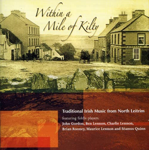 CD cover: sepia-toned Irish street scene with text and red color block.