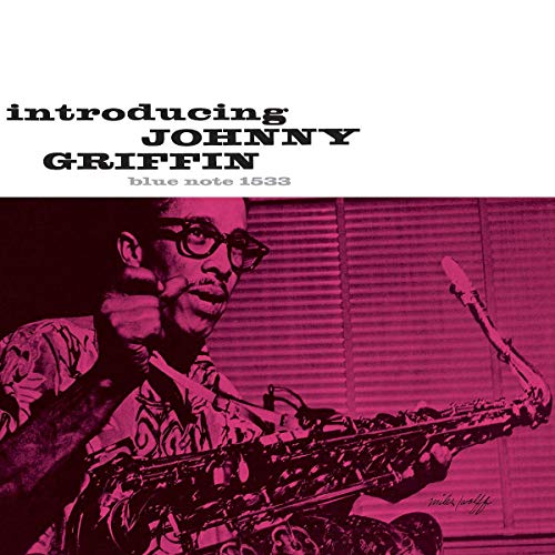 Johnny Griffin album cover: portrait of musician with saxophone, pink tone.