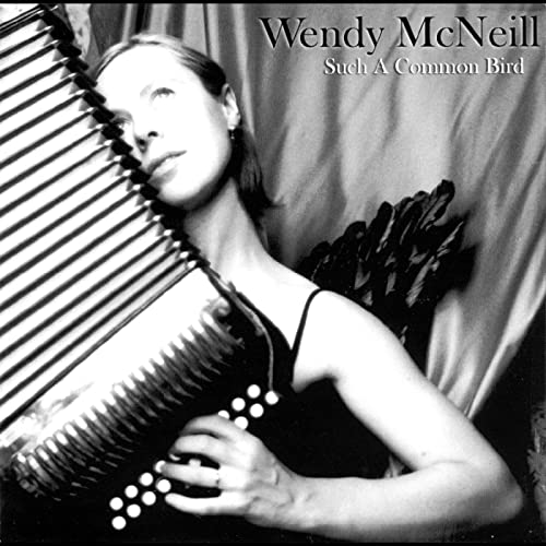 CD cover featuring Wendy McNeill with an accordion and black feathers.