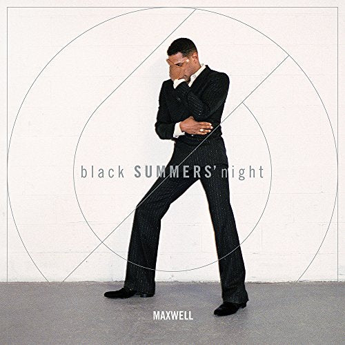 Maxwell in a pinstripe suit stands against a white background with circles.