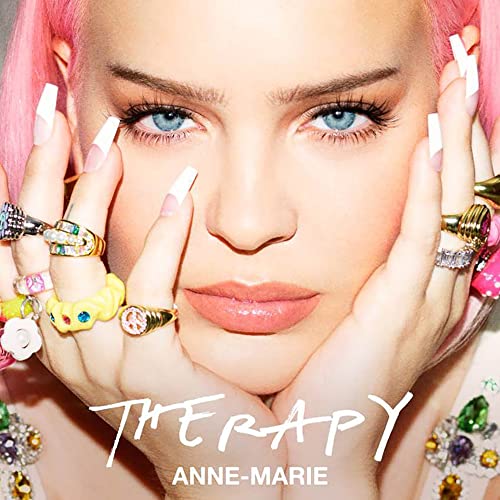 Anne-Marie album cover, close-up of artist with pink hair and rings.