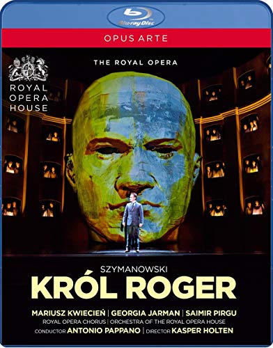 Blu-ray cover featuring a giant green face behind a man in a suit.
