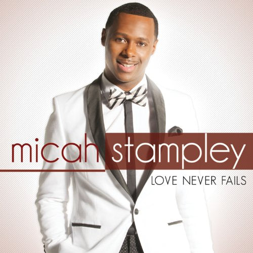 Micah Stampley album cover, “Love Never Fails”, featuring a portrait of the artist.