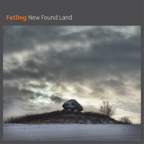 CD cover: rocky hill under a cloudy, winter sky.