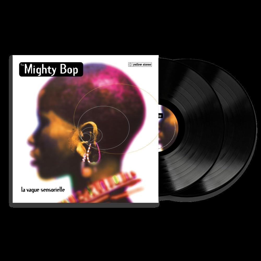 Yellow vinyl record with portrait of a person in profile.