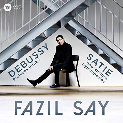Fazil Say portrait on a modern staircase with Debussy and Satie text.