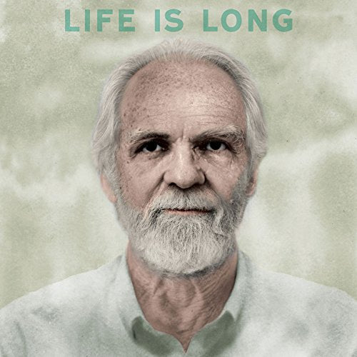 Portrait of an older man with white hair and beard, text reads "LIFE IS LONG".