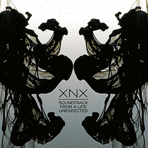 CD cover for "Life Unexpected" soundtrack featuring mirrored, abstract black shapes.