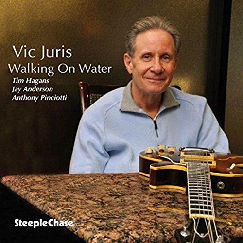 CD cover: Vic Juris portrait with a jazz guitar, text details.