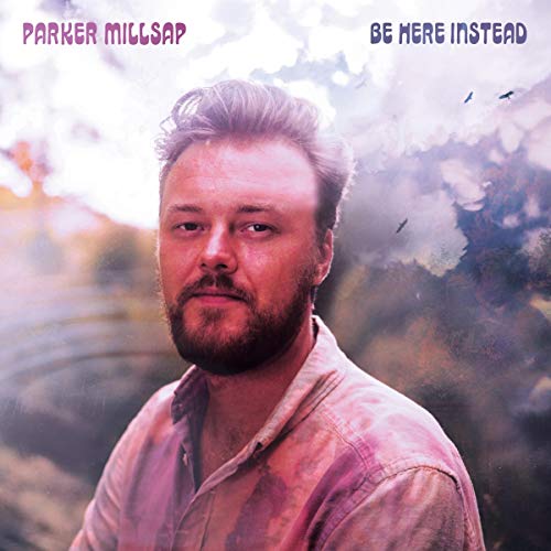 Parker Millsap album cover with portrait and cloudy sky background.