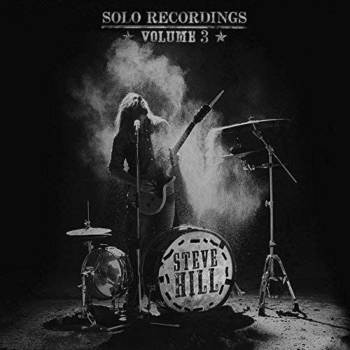 Black and white album cover featuring a guitarist performing with drums.