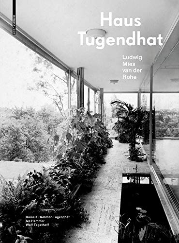 Black and white photo of the glass-walled Tugendhat House interior.