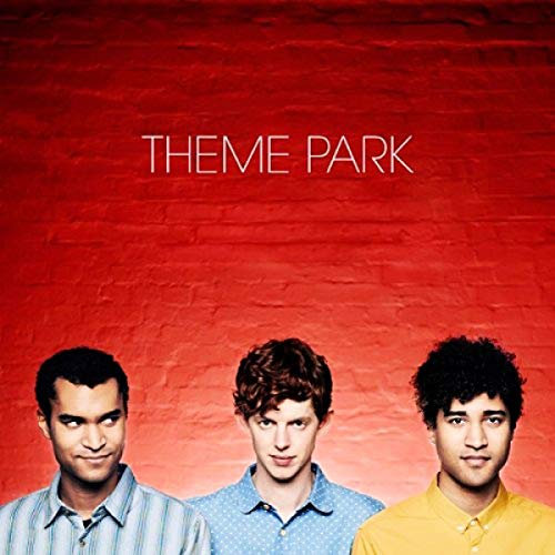 CD cover for "Theme Park" featuring three young men against a red brick wall.