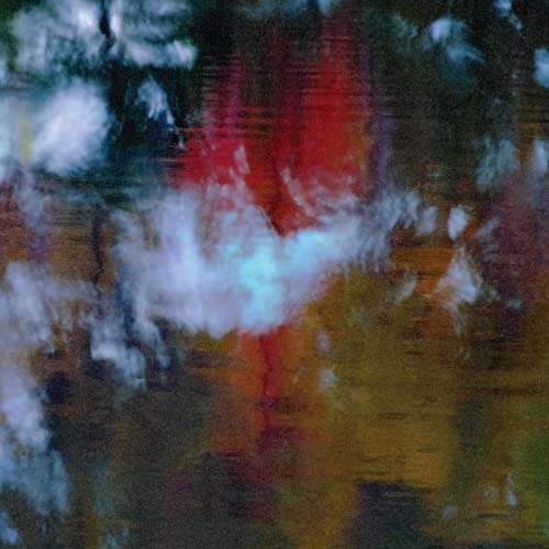Abstract album cover with blurred red and white shapes, grainy texture.