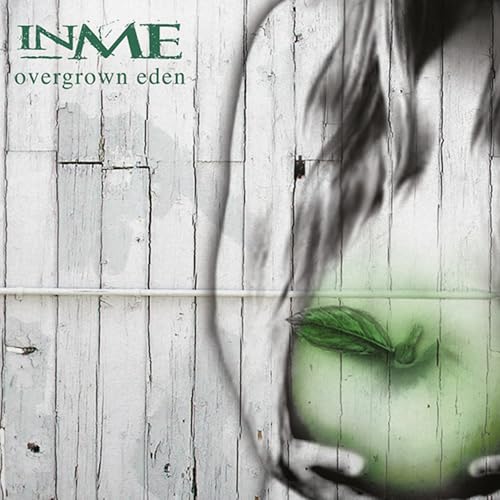 Album cover for Inme’s “Overgrown Eden” featuring a blurred apple and wood.