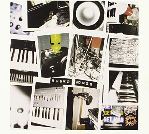 CD cover for Rusko's "Songs" featuring a collage of music equipment.