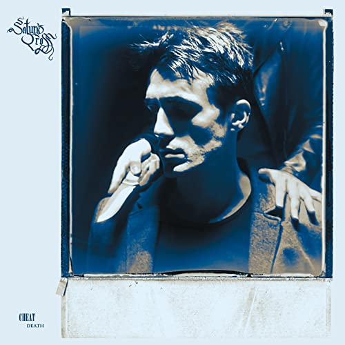 Blue-toned album cover featuring a man holding a knife, close-up portrait.