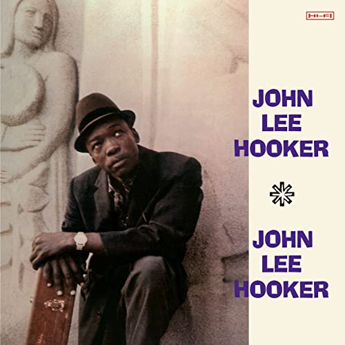 John Lee Hooker album cover featuring a portrait and sculpture.