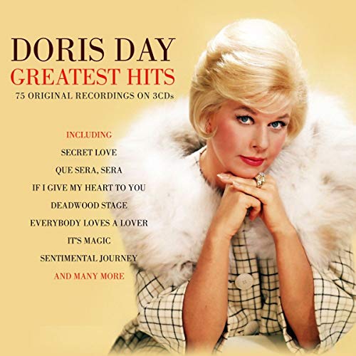 Doris Day wearing a fur-collared coat on the cover of a Greatest Hits CD.