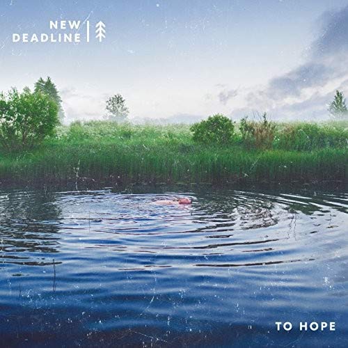 CD cover: person floating in water with grassy landscape.